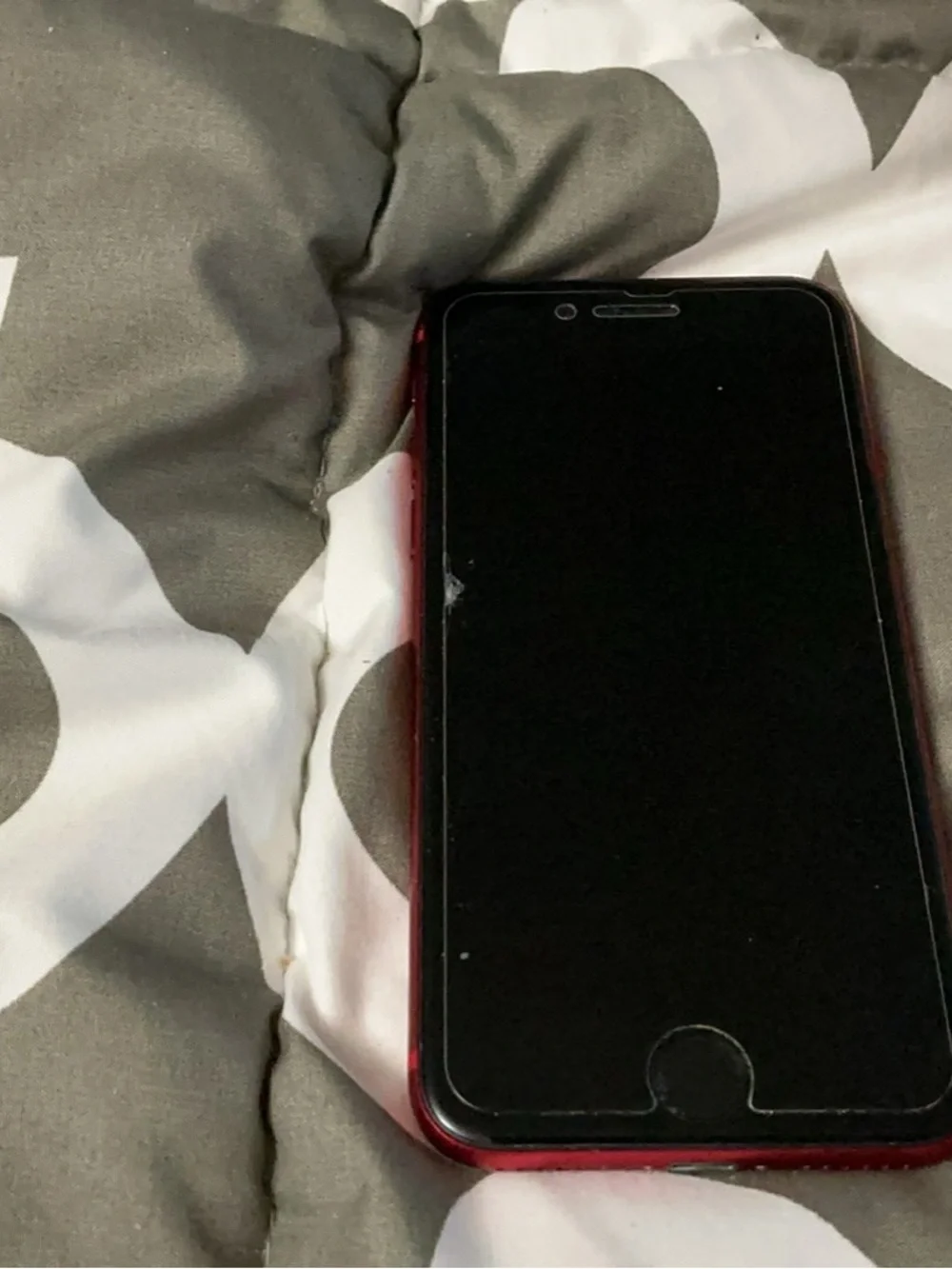 Apple iPhone with Red Case and Black Front